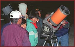The locals line up for a view of the night sky.